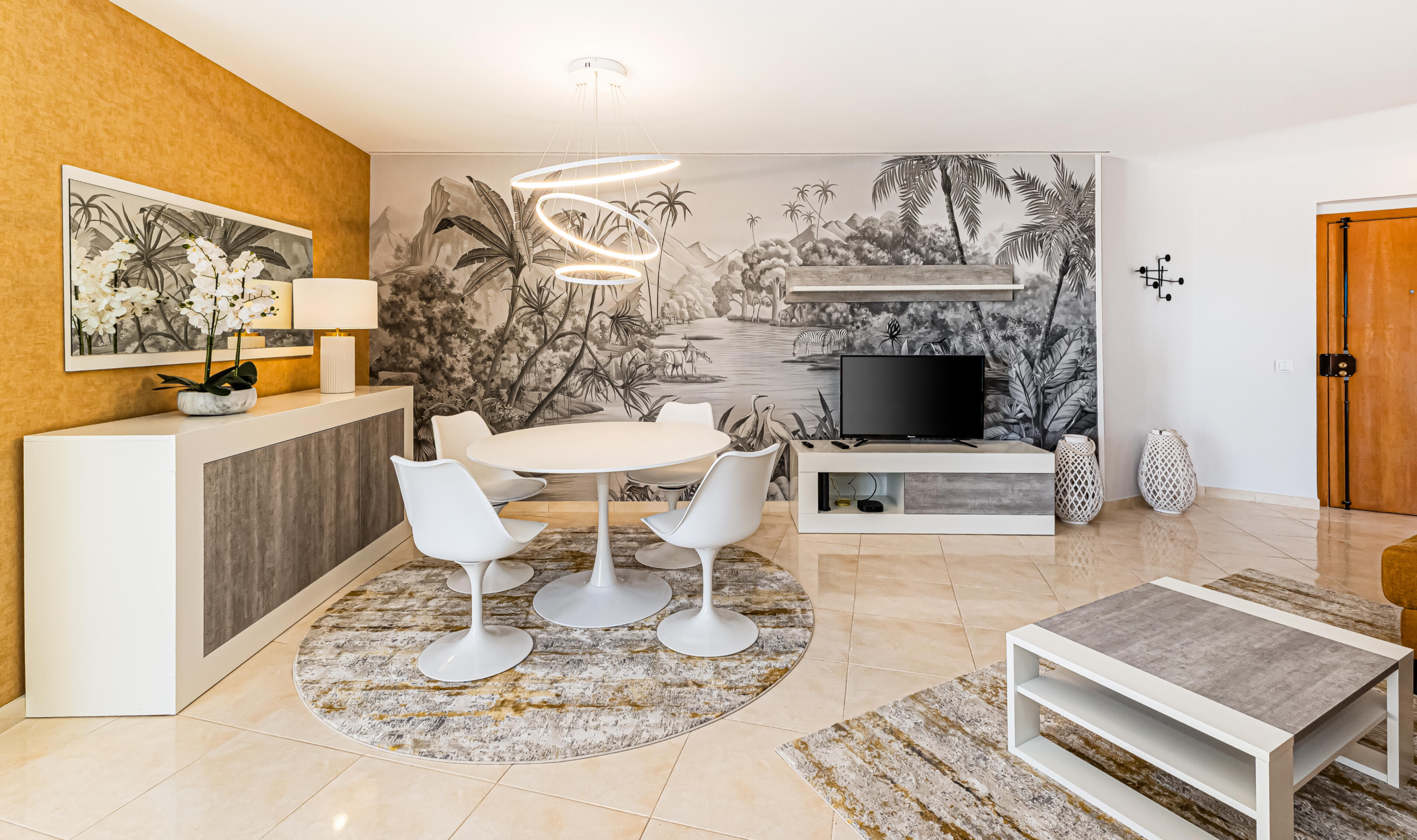 Modern dining area with designer decor in a bright Algarve apartment living space